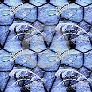 Winter seamless mosaic pattern of cracked stones and frozen plants