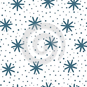 Winter seamless pattern with blue snowflakes on white background. Painted with brush.
