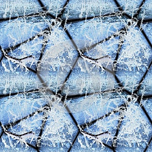 Winter seamless relief pattern of stones covered with ice crystals and frozen twigs