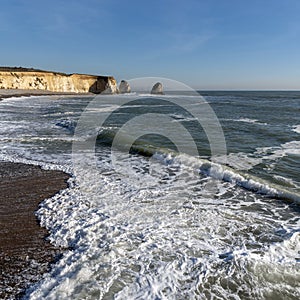 Winter seascape, incoming tide and cliffs