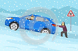 Winter season car driving. Young male character pushes suv car stucked in snow. Traffic sign warns of snow and ice.