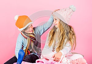 Winter season fashion accessories and clothes. Kids knitted winter hats. Children playful mood christmas holidays pink