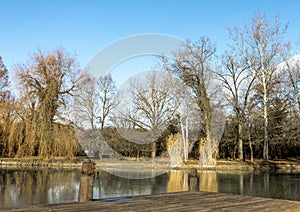 Winter season landscape in a small park with a pond next to Zrinyi Castle, Szigetvar, Hungary