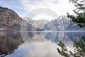 Winter season snow mountain and valley scenic with clear blue sky lake and foreground blur tree. Area for copy space. Taken in Hal