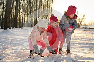 Winter season. Three little girls.