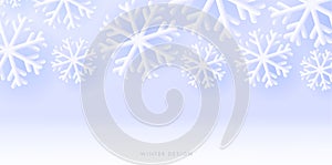 Winter seasonal background with white 3d snowflakes on soft blue backdrop