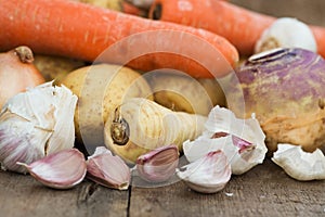 Winter seasonal vegetables collection including potatoes, parsnips, swede and carrots