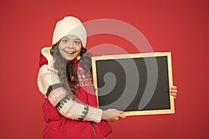 winter shopping sales. announcement board. very profitable proposition. happy girl empty blackboard. copy space. useful