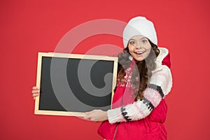 Winter shopping sales. announcement board. very profitable proposition. happy girl empty blackboard. copy space. useful