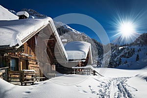 Winter ski chalet and cabin in snow mountain