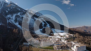 Winter ski resort luxury hotel infrastructure mountain snow peak panorama sunny