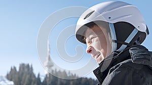 Winter ski vacation in mountains resort, alpine skiing. Smiling child skier, snowy Bulgarian mountain resort Pamporovo
