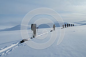 Winter skiing expedition in the far north beyond polar circle