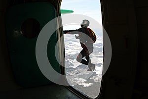 Winter skydiving. A skydiver has just jumped out.