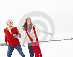 Winter, smile and friends with laughing in snow for vacation, weekend trip and holiday in Canada. Happy, women and