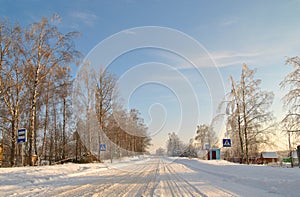 Winter snow covered country road on a sunny day