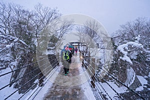 In the winter snow is heavy tourist walking on the street to Shirakawa-go at Gifu  Japan