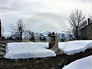 Winter, snow, roof, chimney stack and mountains