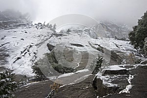 Winter Snow Storm and Granite Cliffs in Yosemite National Park