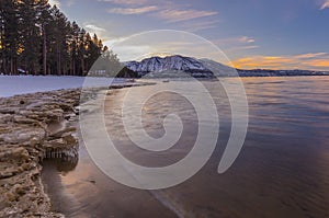 Winter and snow topped mountains - sunset at Lake Tahoe california