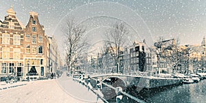 Winter snow view of a Dutch canal in Amsterdam