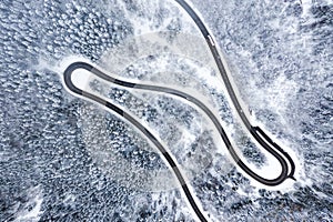 Winter snow winding road Serpentine Switchbacks forest woods season aerial photo view