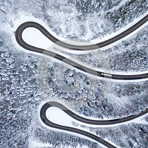 Winter snow winding road Serpentine Switchbacks forest woods season aerial photo view square