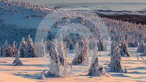 Winter snowed up mountain ridge at sunrise