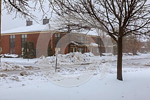 Winter snowing and wind blowing residential area in the blizzard