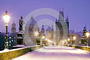 Winter snowy Charles bridge, gothic Old Town bridge tower,Old to