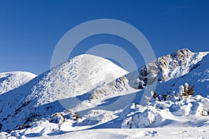 Winter snowy landscape at mountain during a sunny day