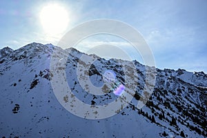 Winter snowy mountains landscape. Snowy mountains in sunny winter day.