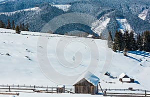 Winter snowy mountains, and lone farmhouse