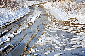 Winter snowy road through frozen forest
