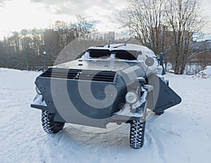In the winter on a snowy road, a German armored car