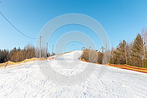 Winter snowy track for descent from the mountain. Winter sports concept. Winter extreme sport. Ski resort