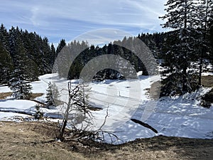 A winter sport cross-country ski trail around a frozen alpine Heidsee lake (Igl Lai lake) in the Swiss winter resorts