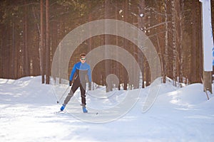 Winter sport, male skier is racing cross-country skiing, sunlight sunset