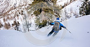 Winter sport: man skiing in powder snow.