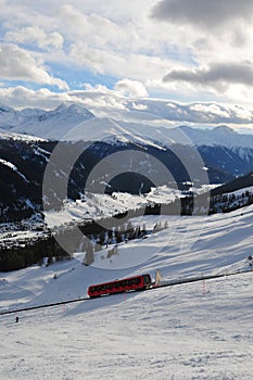 Winter sport swiss alps: The Davos-Parsenn cable car drives up the mountain