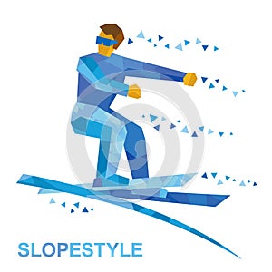 Winter sports - Ski Slopestyle. Freestyle skier jumps an obstacl photo