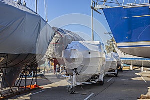 Winter storage of boats and yachts in a yacht club. Special technologies to protect boats from damage.