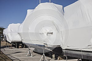 Winter storage of boats and yachts in a yacht club. Special technologies to protect boats from damage.