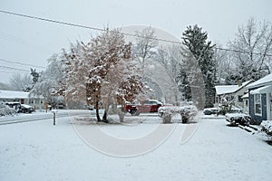 Winter storm over residential neighborhood yard wide angle