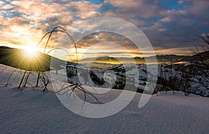 Winter sunrise in mountainous rural area