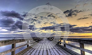 Winter sunrise on a pier photo