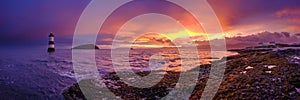 Winter sunrise on Trwyn Du Lighthouse at Penmon Point, Anglesey, Wales