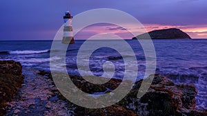 Winter sunrise on Trwyn Du Lighthouse at Penmon Point, Anglesey, Wales