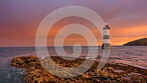 Winter sunrise on Trwyn Du Lighthouse at Penmon Point, Anglesey, Wales