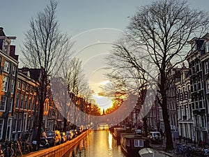 Winter sunset on the Amsterdam canal with reflection